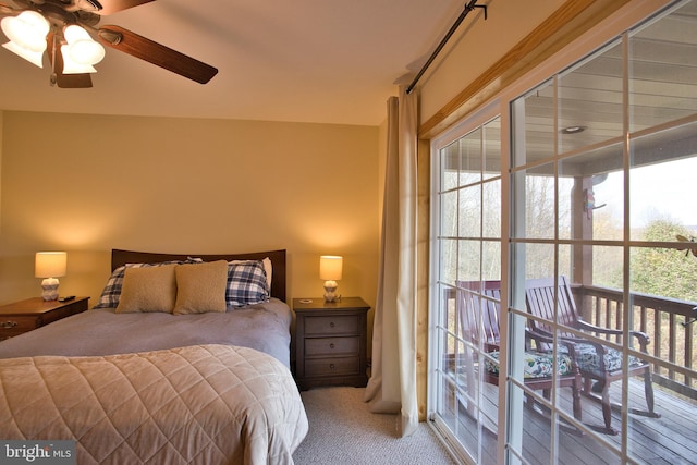 bedroom featuring access to exterior, light colored carpet, and ceiling fan