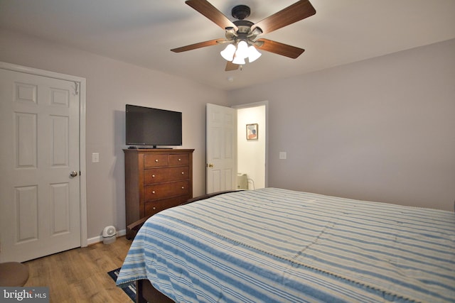 bedroom with ceiling fan and light hardwood / wood-style flooring