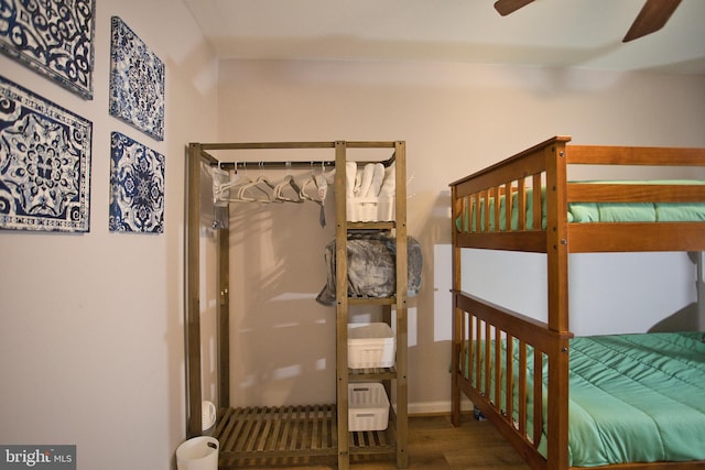 bedroom featuring dark wood-type flooring and ceiling fan