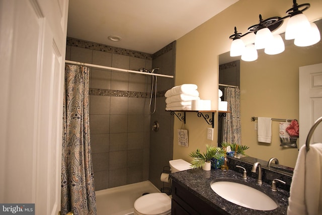 bathroom featuring walk in shower, vanity, and toilet