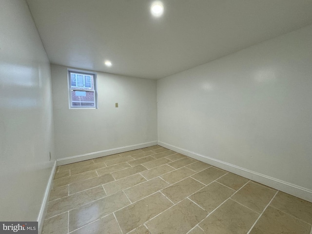 spare room featuring light tile patterned flooring