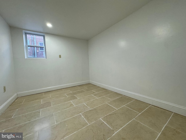 unfurnished room featuring light tile patterned flooring