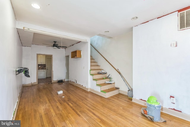 interior space featuring ceiling fan and light wood-type flooring