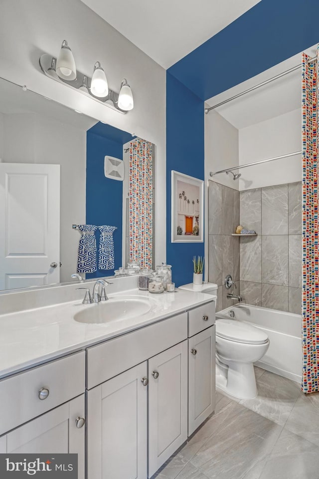 full bathroom featuring vanity, shower / bathtub combination with curtain, and toilet