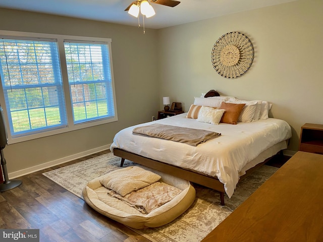 bedroom featuring dark hardwood / wood-style flooring and ceiling fan