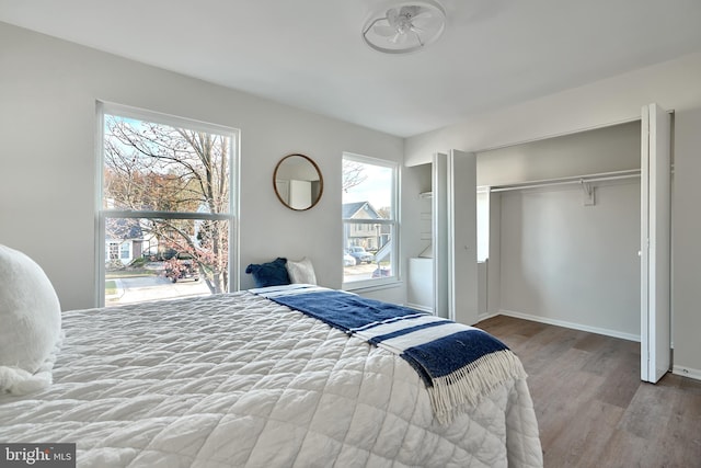 bedroom featuring a closet and hardwood / wood-style flooring