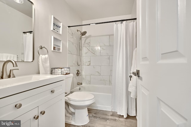 full bathroom featuring hardwood / wood-style flooring, vanity, toilet, and shower / bath combination with curtain