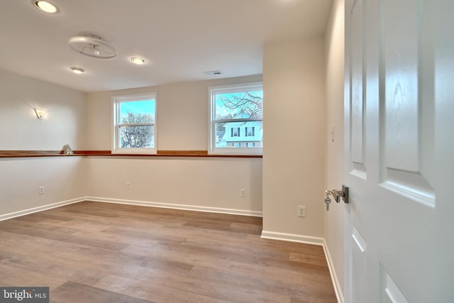 spare room featuring hardwood / wood-style floors