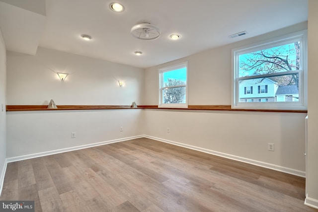 empty room featuring hardwood / wood-style floors