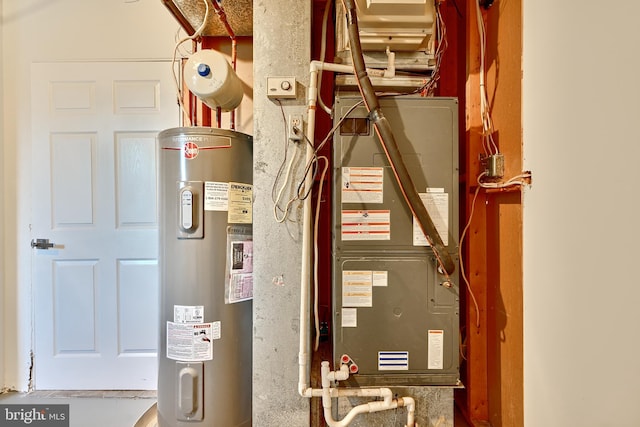 utility room featuring water heater and heating unit