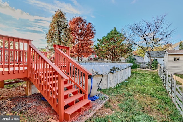 view of yard with a pool side deck