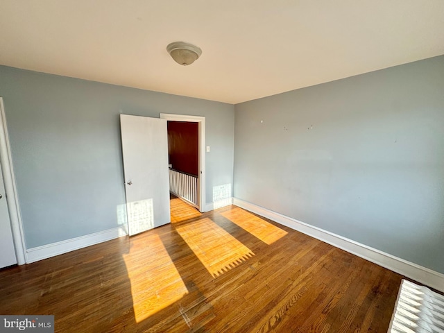 spare room featuring hardwood / wood-style flooring