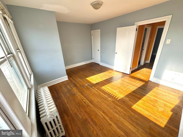 unfurnished room featuring hardwood / wood-style floors