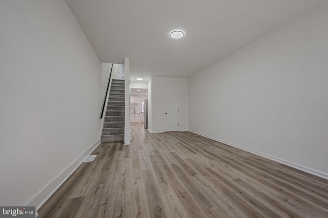 unfurnished living room featuring light hardwood / wood-style floors