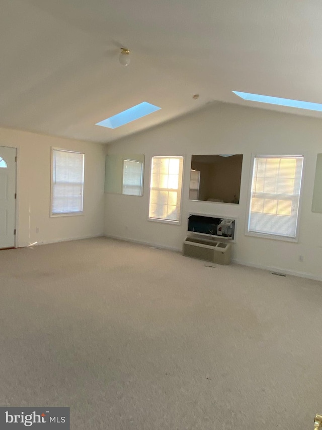 9 Cypress Pl, Indian Head, MD 20640 - unfurnished living room featuring a skylight, carpet, healthy amount of natural light, and vaulted ceiling