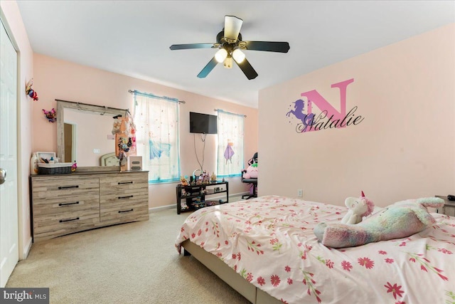 bedroom with ceiling fan and light colored carpet