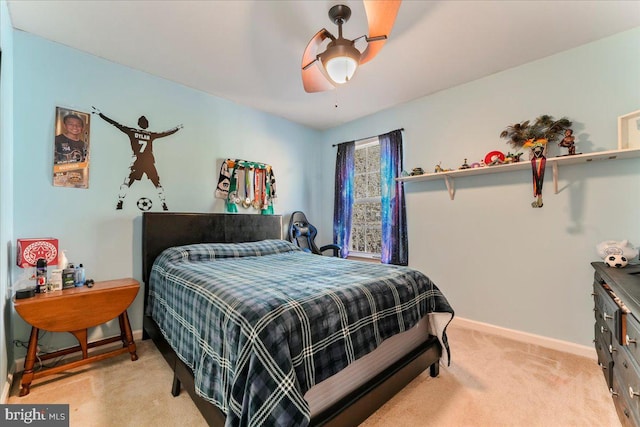 bedroom with light colored carpet and ceiling fan