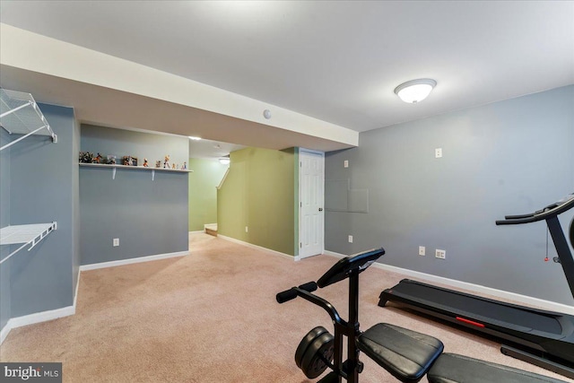 exercise room with light carpet