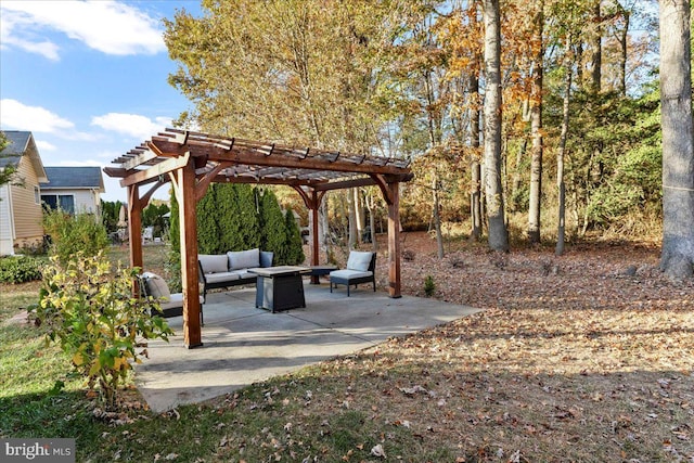 view of patio / terrace with an outdoor living space with a fire pit and a pergola