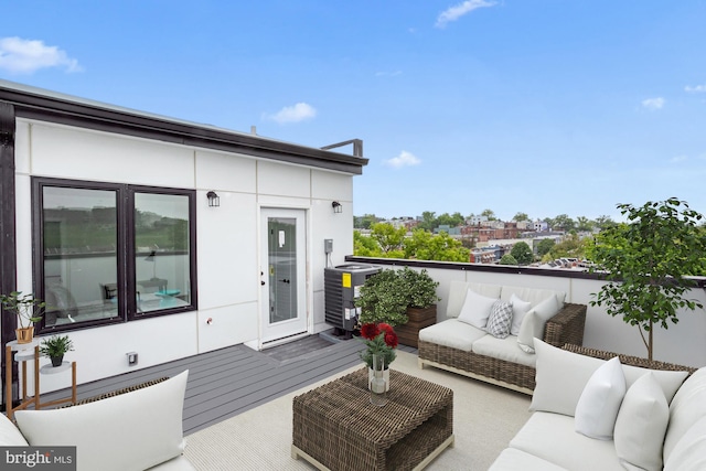 deck with central AC and an outdoor hangout area