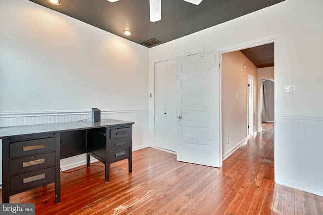 office area with wood-type flooring and ceiling fan