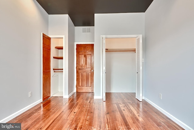 unfurnished bedroom with light hardwood / wood-style floors