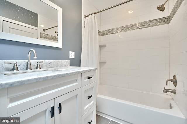 bathroom featuring vanity and shower / tub combo