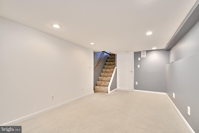 basement with light carpet