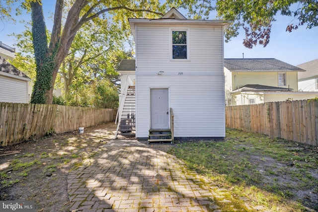 back of property featuring a patio area