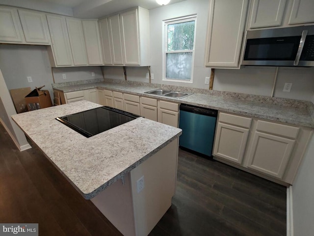 kitchen with white cabinetry, dark hardwood / wood-style flooring, sink, and appliances with stainless steel finishes