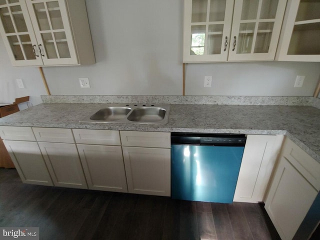 kitchen with dishwasher, dark hardwood / wood-style flooring, white cabinetry, and sink