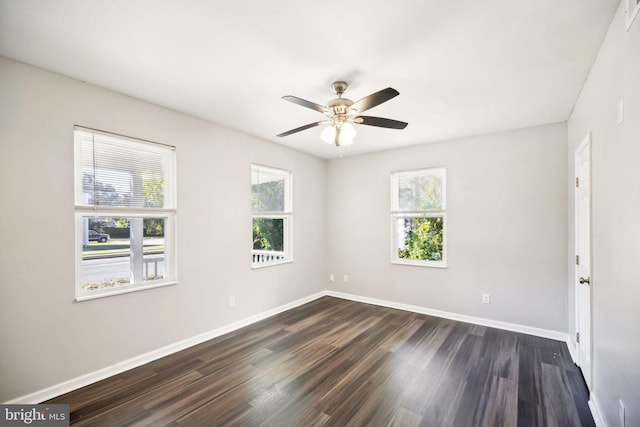 unfurnished room with ceiling fan and dark wood-type flooring