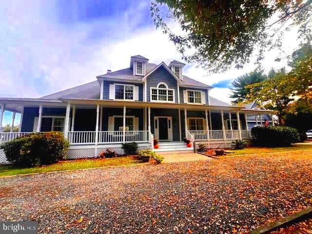 country-style home with covered porch