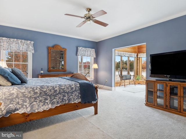 bedroom with carpet flooring, ceiling fan, and ornamental molding