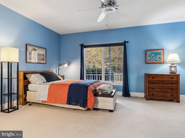 bedroom featuring ceiling fan and light colored carpet