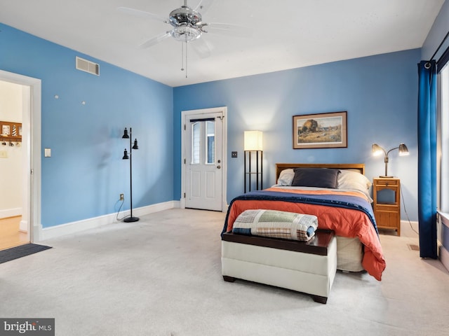 bedroom with ceiling fan and light colored carpet