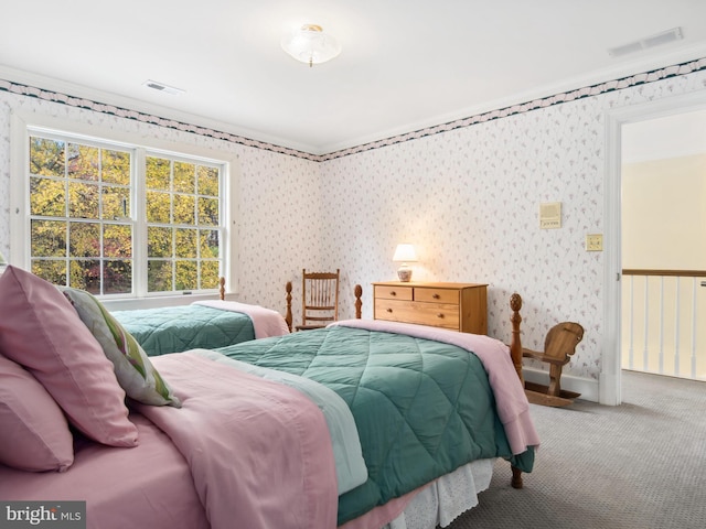 bedroom featuring carpet floors and ornamental molding