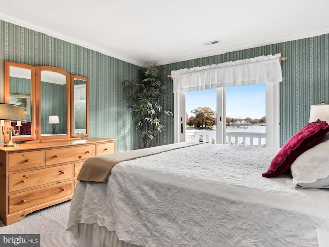 bedroom with carpet flooring and access to outside