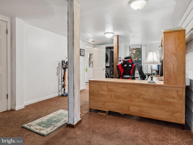 reception featuring stacked washer / drying machine