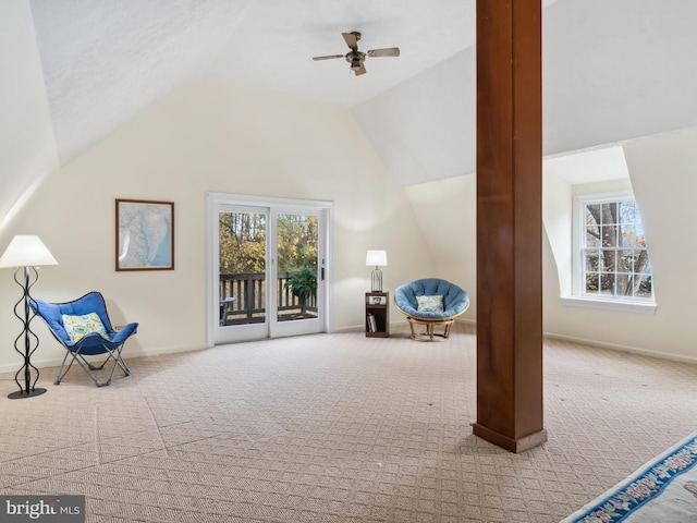 unfurnished room featuring ceiling fan, light colored carpet, and vaulted ceiling