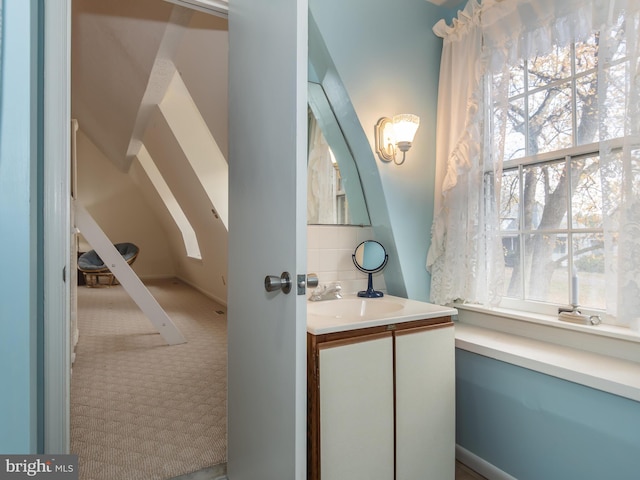 bathroom with vanity and a wealth of natural light