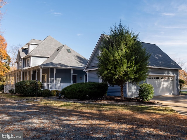 view of front of home featuring covered porch and a garage