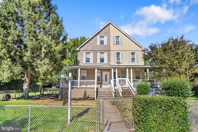 view of front of home with a porch and a front yard