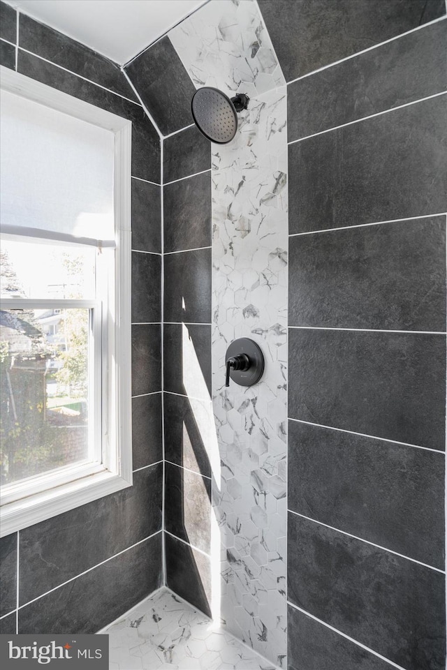 bathroom with tiled shower