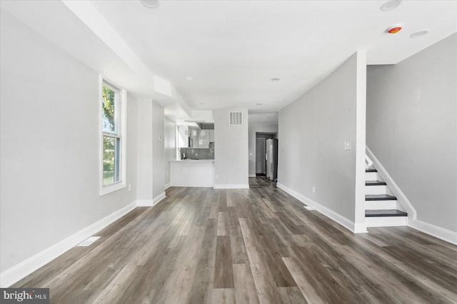 unfurnished living room featuring wood-type flooring