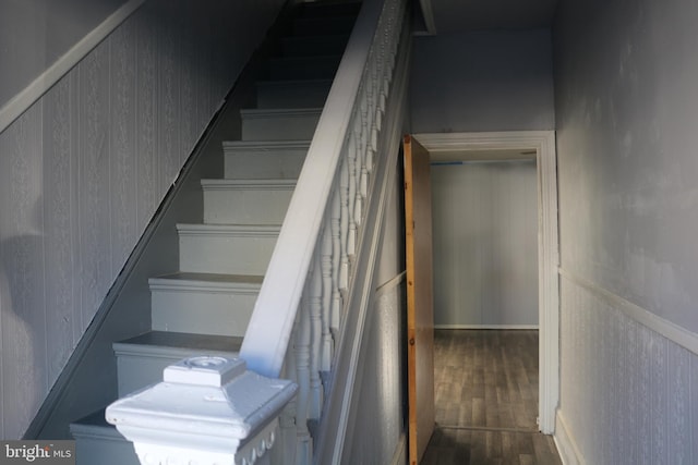 stairway featuring hardwood / wood-style flooring