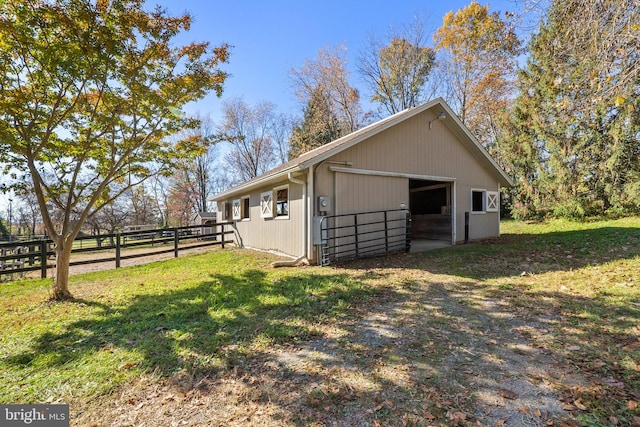 view of side of property featuring an outbuilding