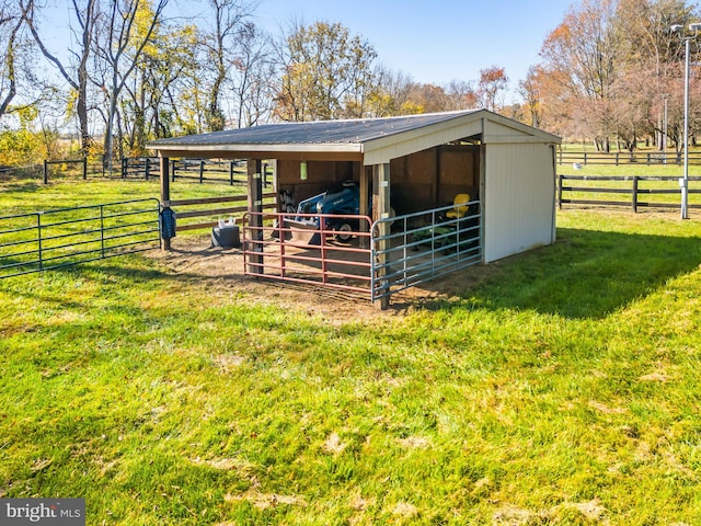 view of horse barn featuring a rural view