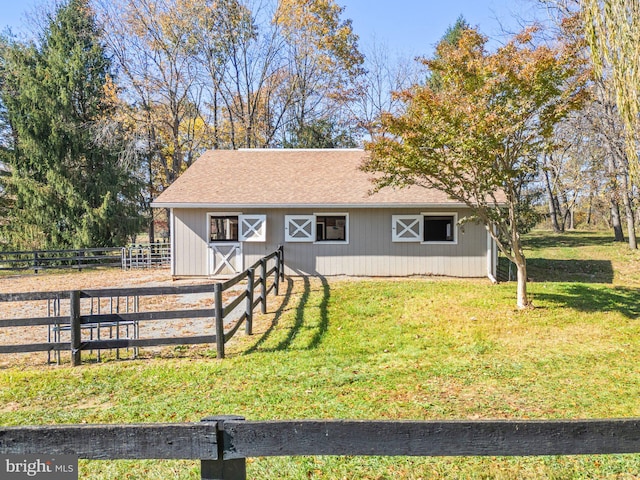 view of front of house featuring an outbuilding