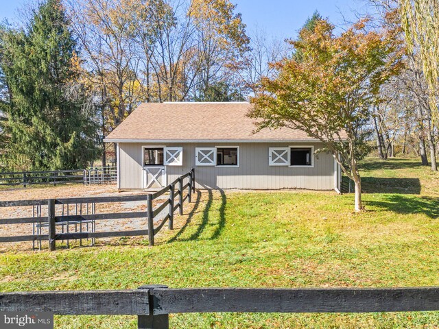 view of front of property with an outbuilding